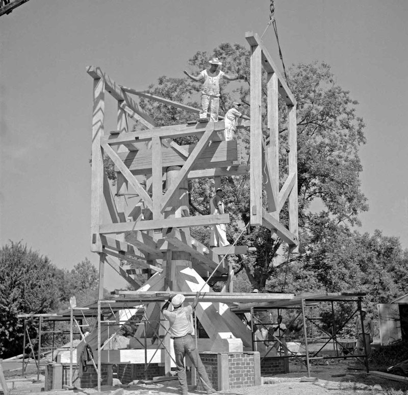 A black and white photo from 1956 of the construction of the windmill.