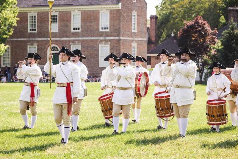 A photo of Colonial Williamsburg&#x27;s Fife and Drum Corps on Market Square green.