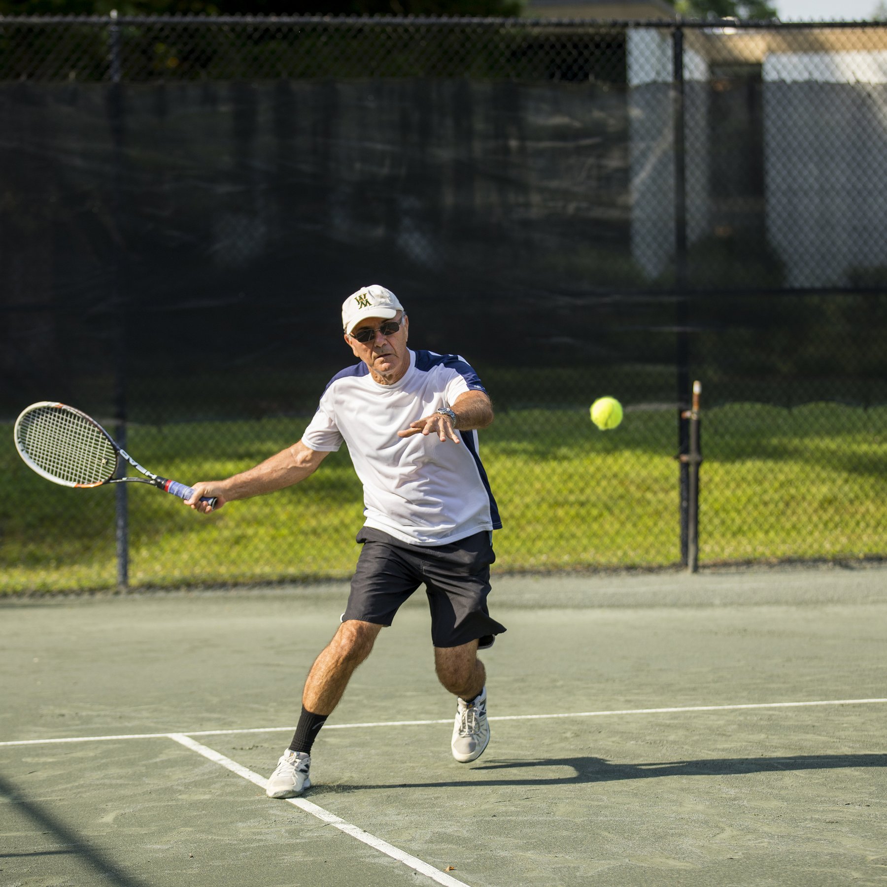 W&M Cap Man Playing Tennis