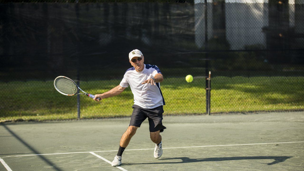 W&M Cap Man Playing Tennis