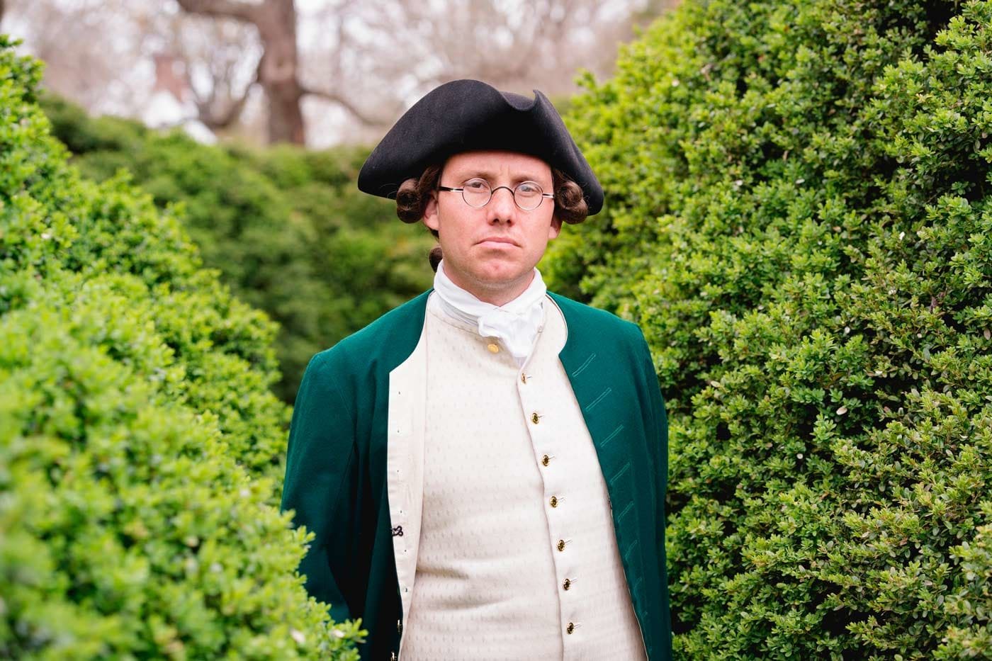 An interpreter dressed as George Mason faces forward.