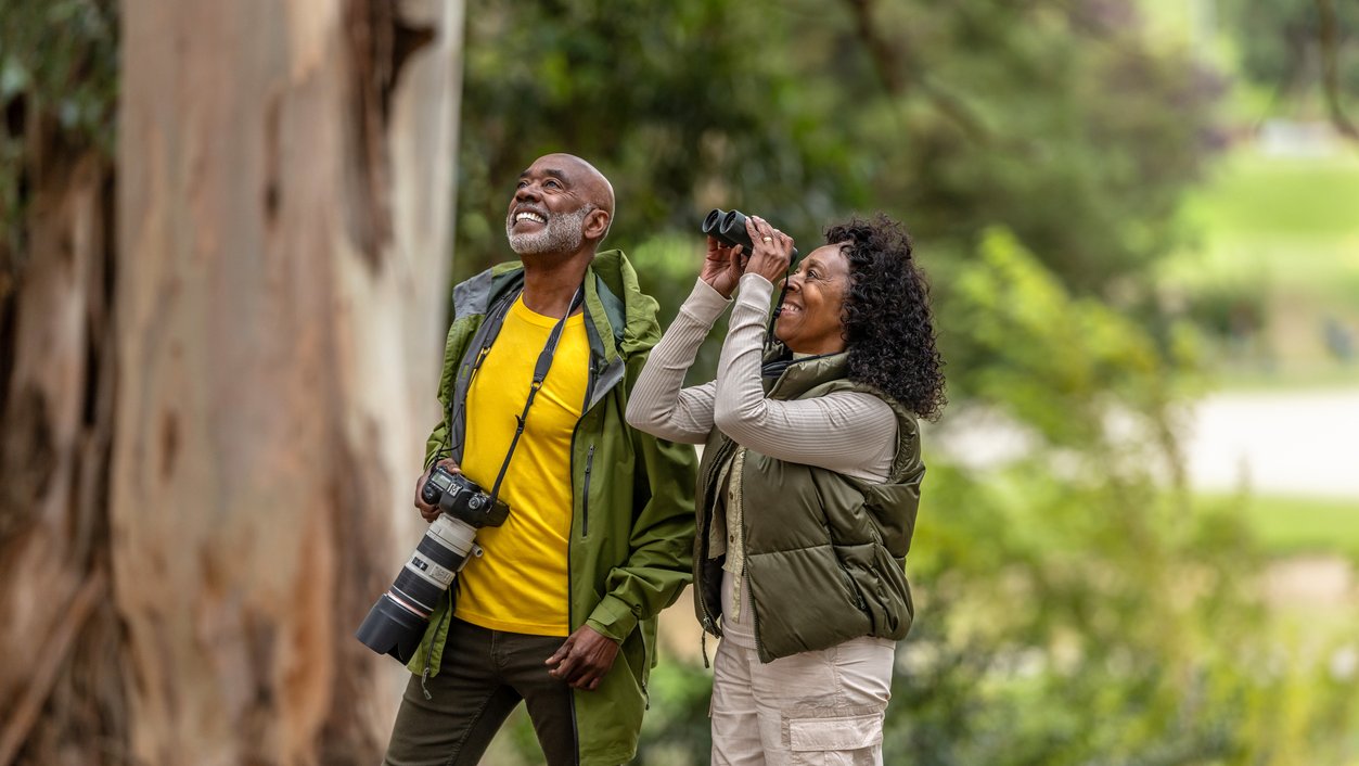 Couple Bird Watching While Hiking