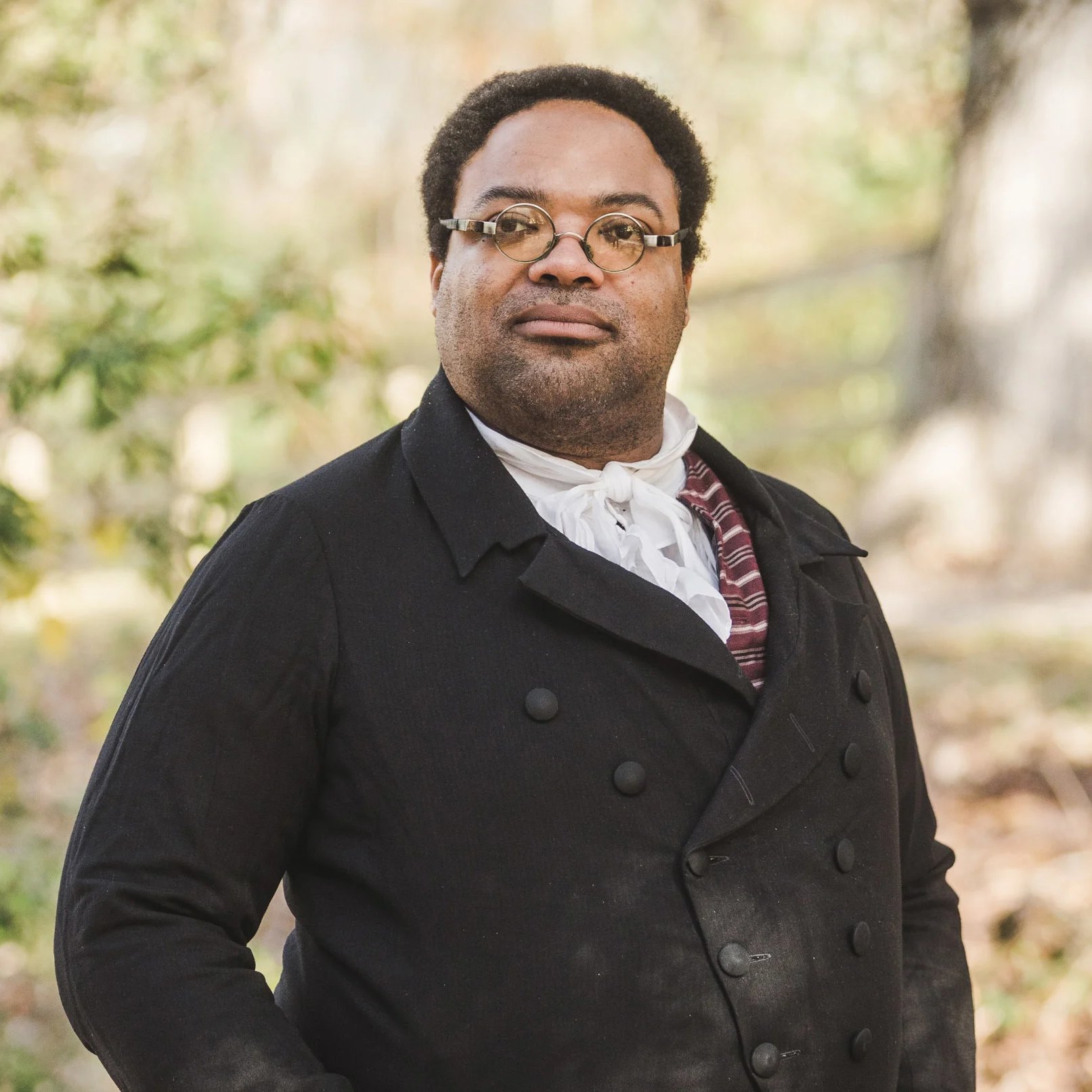 An interpreter dressed as James Armistead Lafayette faces forward.