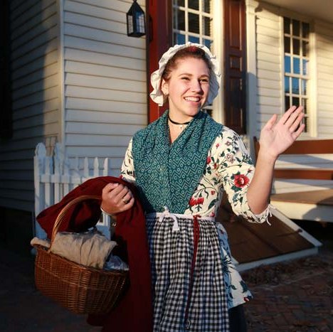 woman-waving-raleigh-porch-2018